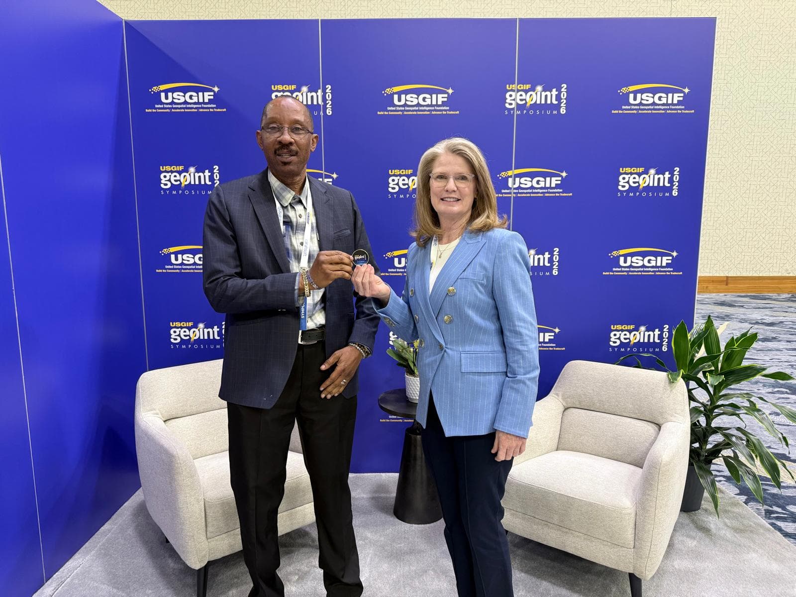 The Founder, Dr AA. Usman recognized and honored with the USGIF GOLD COIN by the Chief Executive of the United States Geospatial Intelligence Foundation (USGIF) Ronda Schrenk